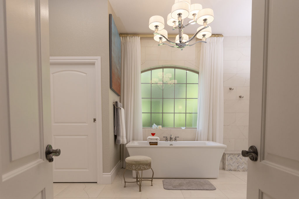 Modern master bathroom remodel San Antonio Oak Park Northwood with freestanding tub and frameless shower wall