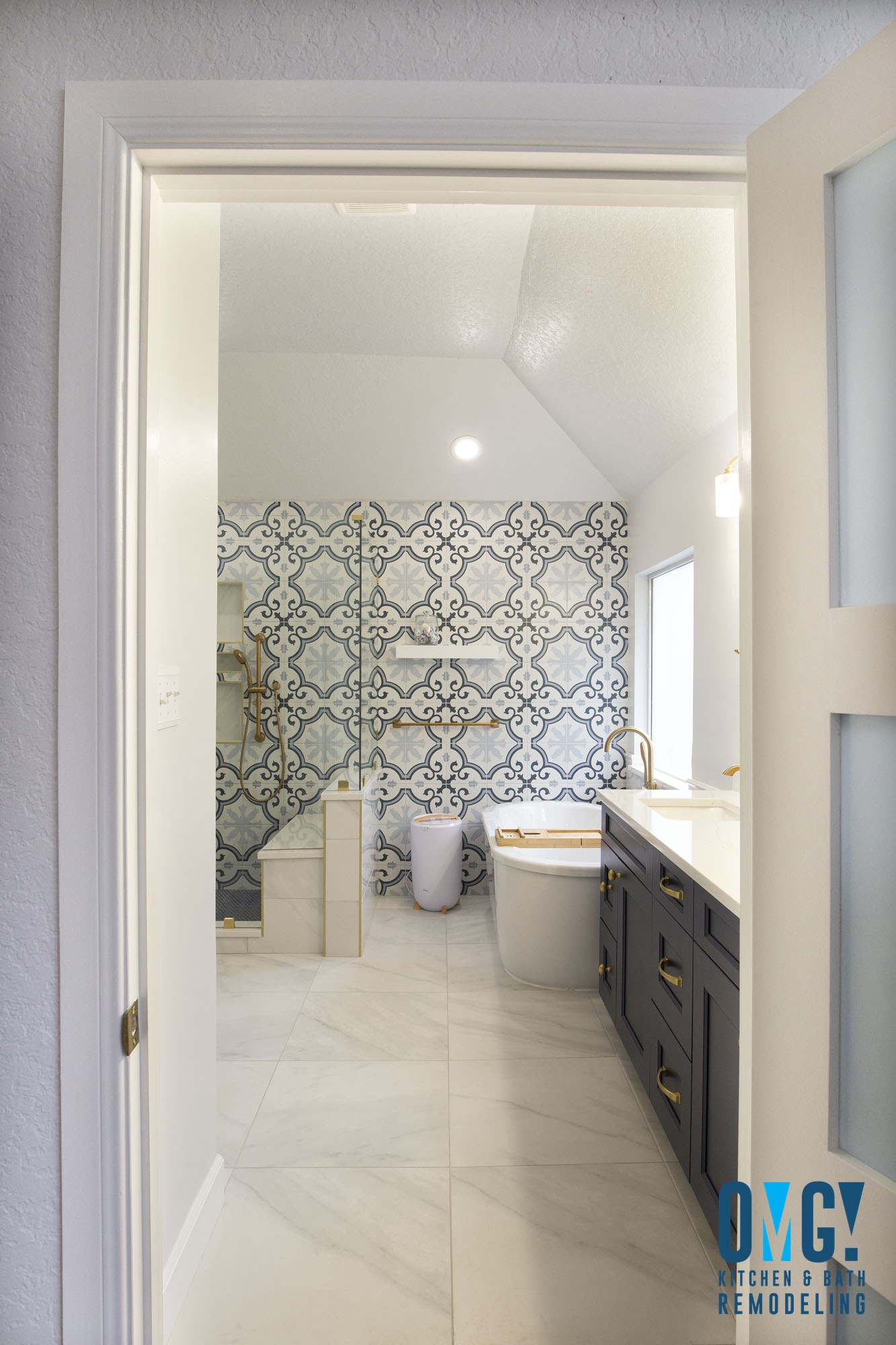 After Oakland Heights master bathroom remodel San Antonio TX with white double vanity and brushed gold faucets