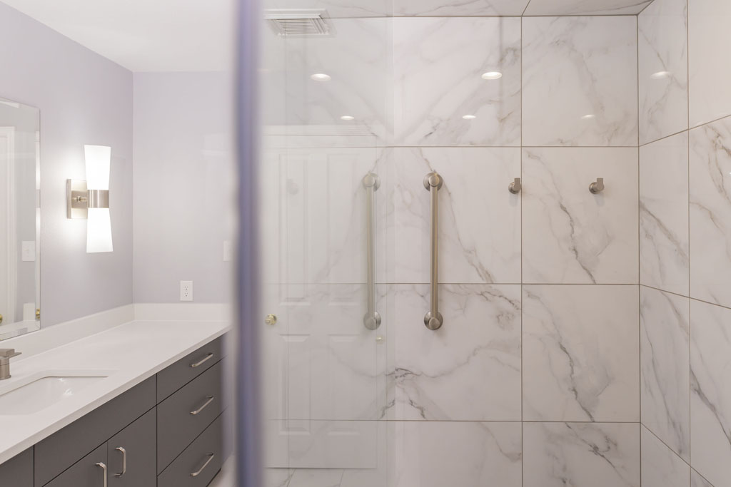 Bathroom renovation San Antonio with quartz vanity and modern fixtures