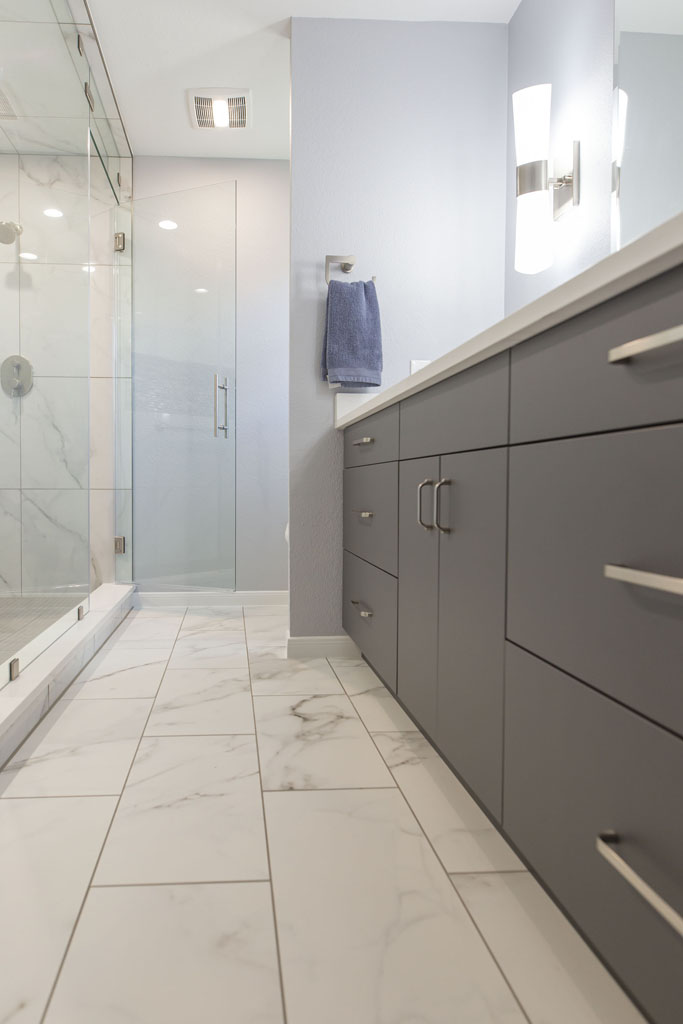 Contemporary bathroom remodel San Antonio with full-height tile and stand-in shower
