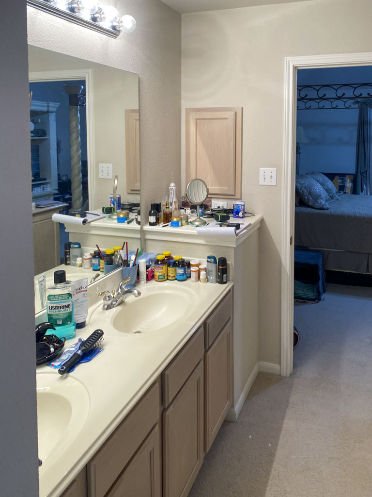 Before bathroom remodel San Antonio with carpet running to the shower entry