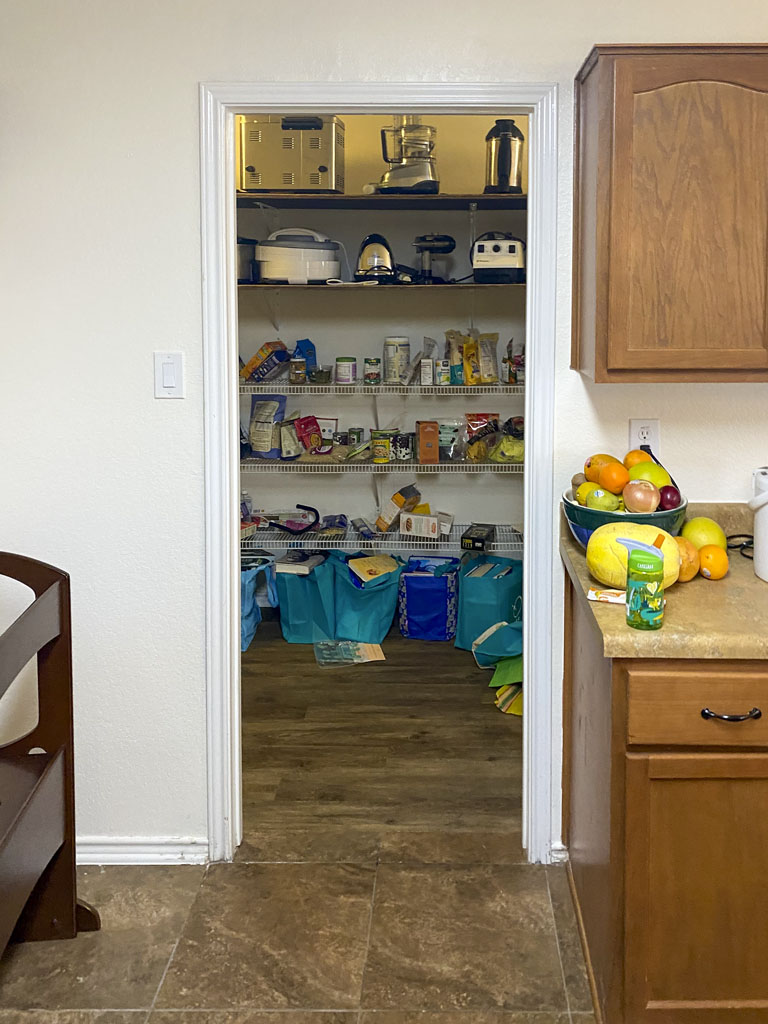 Before kitchen remodel San Antonio with laminate countertops and electric stove with microwave vent hood combo