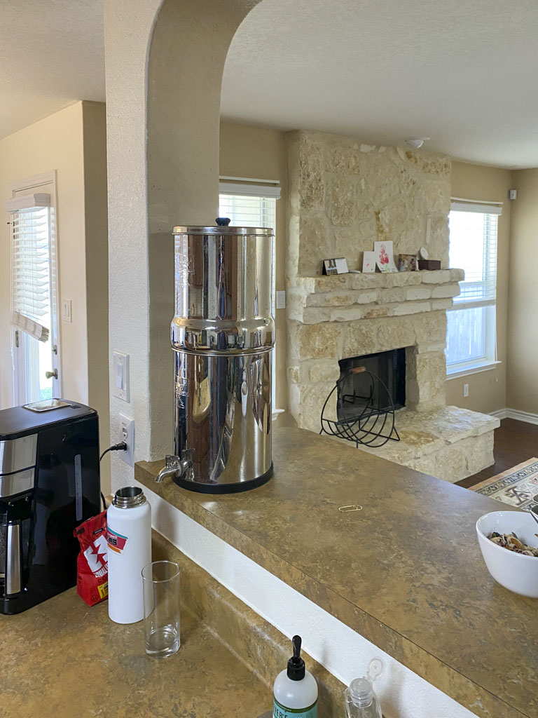 Before kitchen remodel San Antonio with central island, top-mounted sink and traditional cabinetry