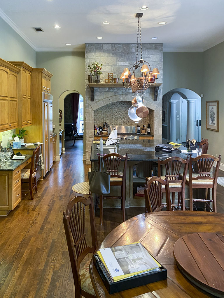 Before kitchen remodel in Oak Park Northwood San Antonio with brown wooden cabinets and laminate countertops