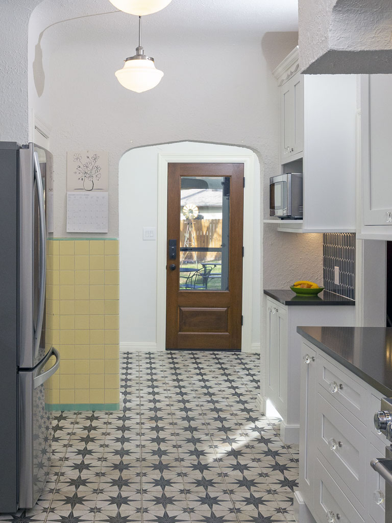 After kitchen remodel Monticello Park San Antonio - white cabinets blue backsplash