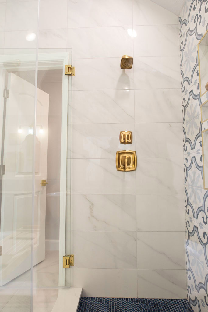 Walk-in shower bathroom remodel San Antonio TX with frameless glass and Moen showerhead